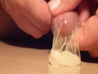 Slow jerking until cum in Condom