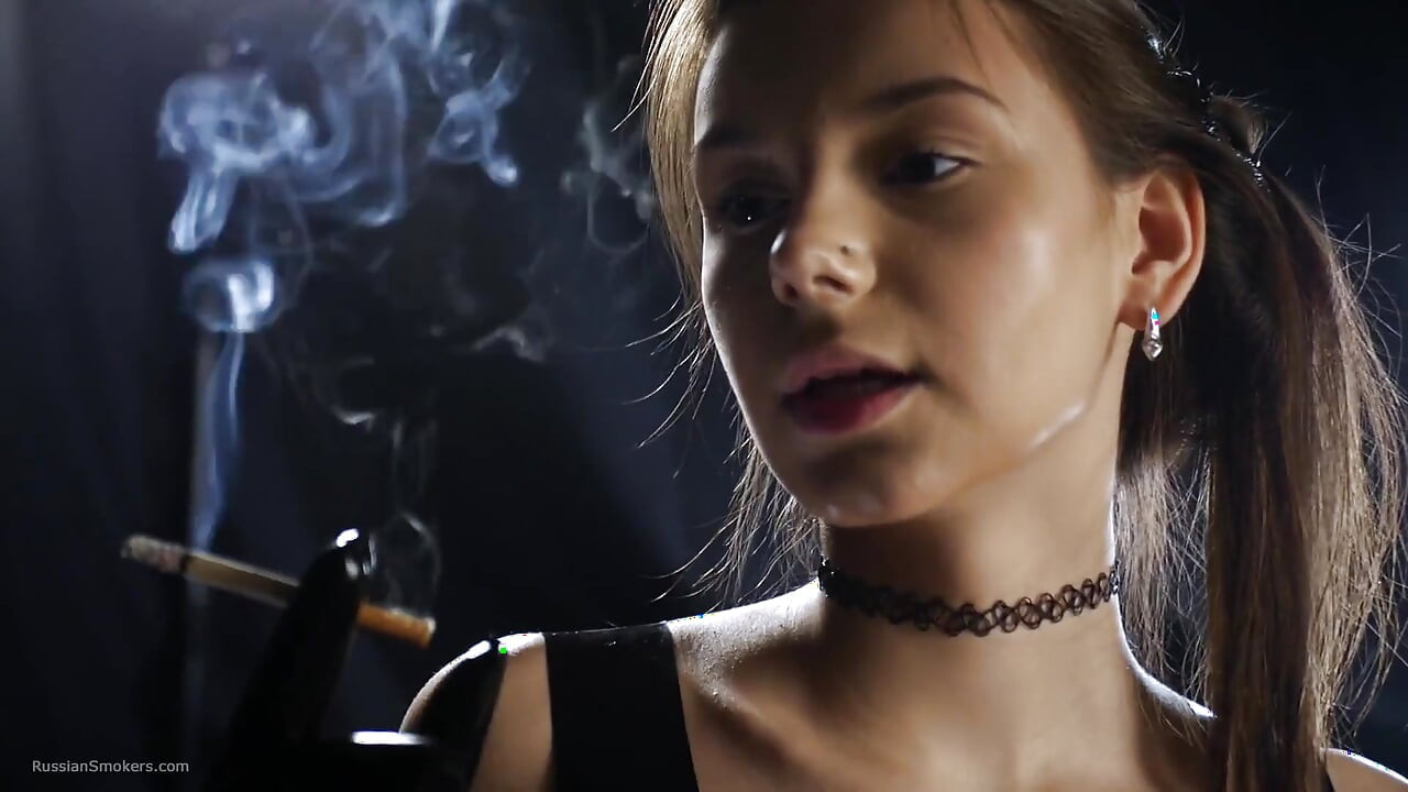 Brunette Smoking in Black Latex Outfit Slow Sensual Scene