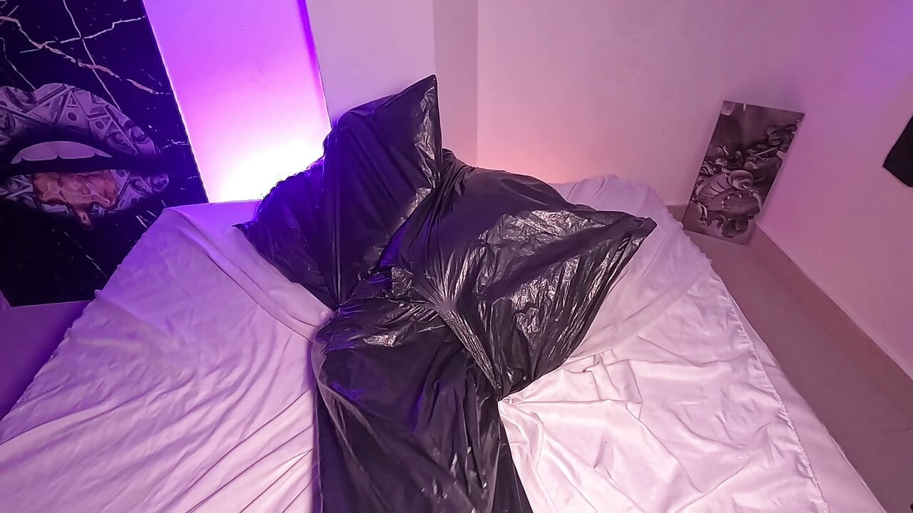 Girl in Garbage Bag Plays with Her Breath