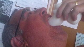 Sucking on a soft white dildo