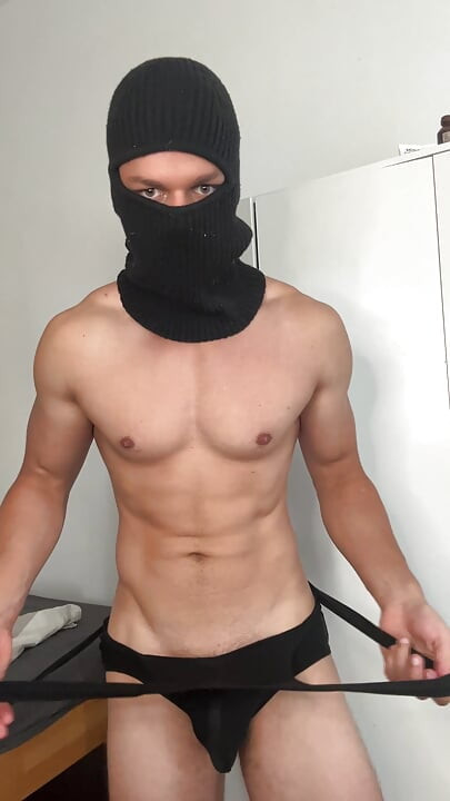 Muscle hunk teasing in a tight singlet