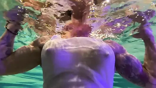 Amazon Kandy Flexes Her Massive Biceps in Her Hotel Pool