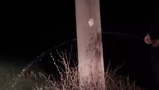 Demon having a long piss out in the open