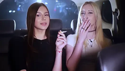 Two Women Smoking and Chatting in a Car at Night