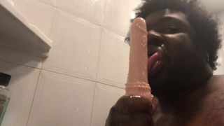 Sucking a didlo in the shower