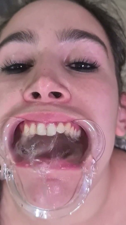 French maid tries to swallow her own piss through lip retractor | Clip 2