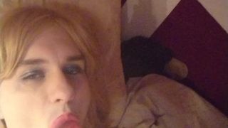 sucking on my dildo in my bed