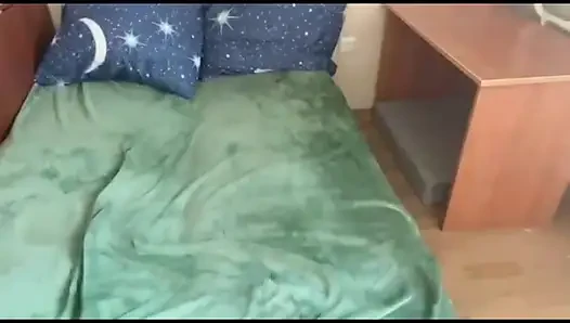 Daphne Key having fun on the bed by herself, using a toy.