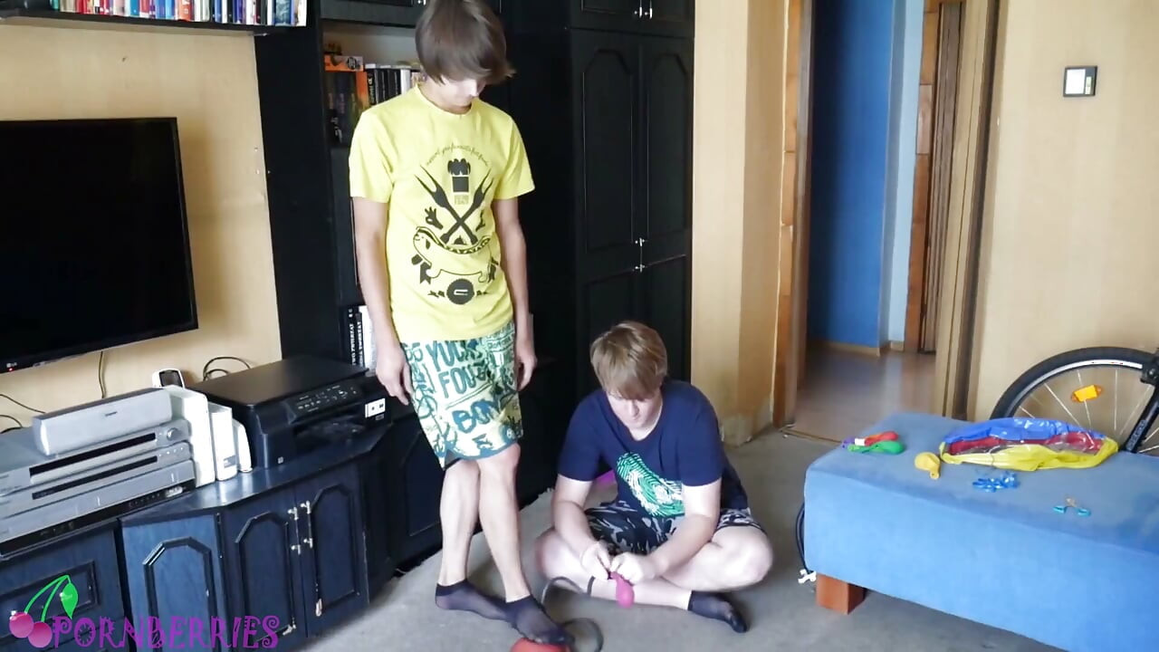 Thin, black socks blowing up balloons + footjob
