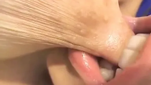 Girl sucking her own nipple