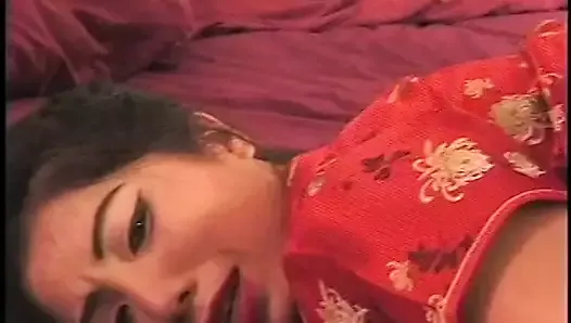 Asian slut has interracial sex with white stud on the bed