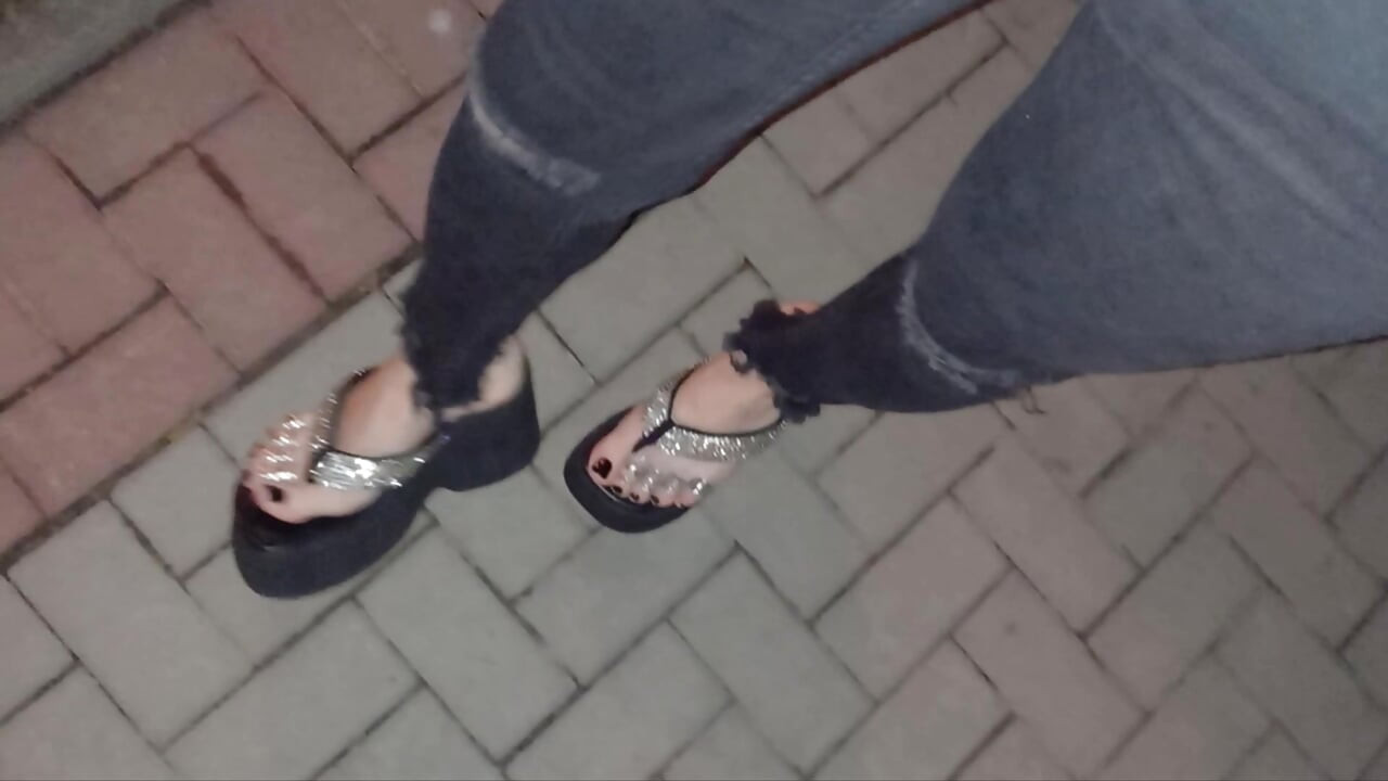 I wear platform flip-flops and tight jeans, showing off my feet.