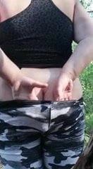 Girl in the woods with veg up her ass
