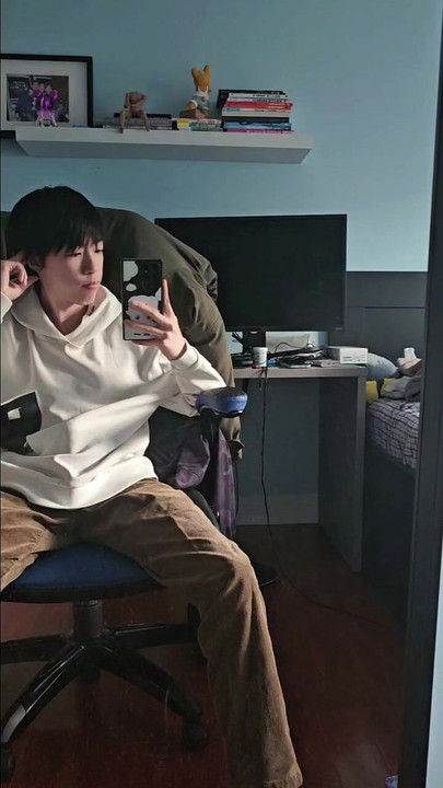 Asian boy taking selfie in front of mirror and secretly get hard
