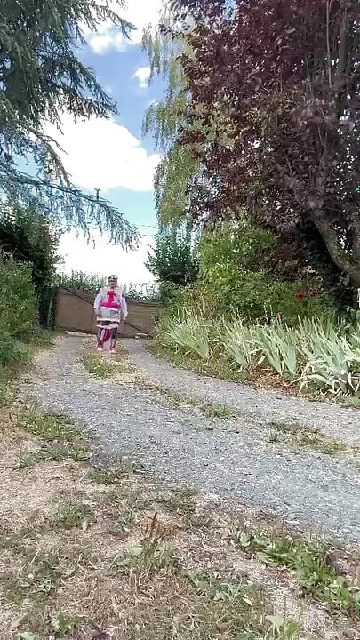 In gardener's clothes with a little leopard dress soaked with pee