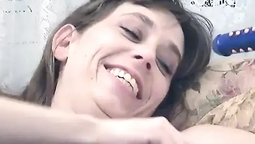 Horny whore has a dildo fucking her tight pussy