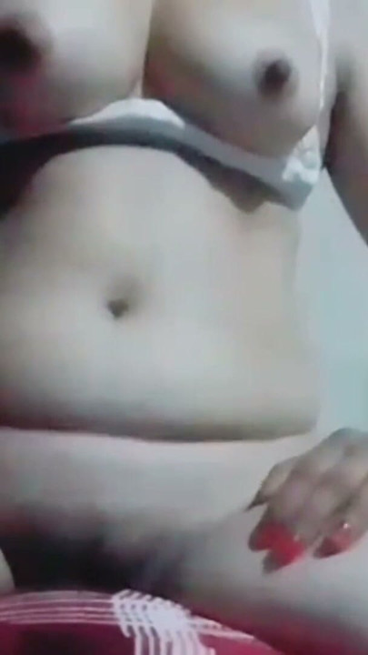 Hot desi bhabhi is masturbating while pressing her boobs and caressing her nipples, she is getting orgasm while caressing her | Clip 1