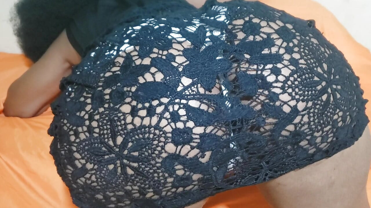 A Woman in a Black Dress at the Hotel with Her Panties Teasing Her Butt