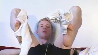 Twink cuts his socks off and teases with feet and toes