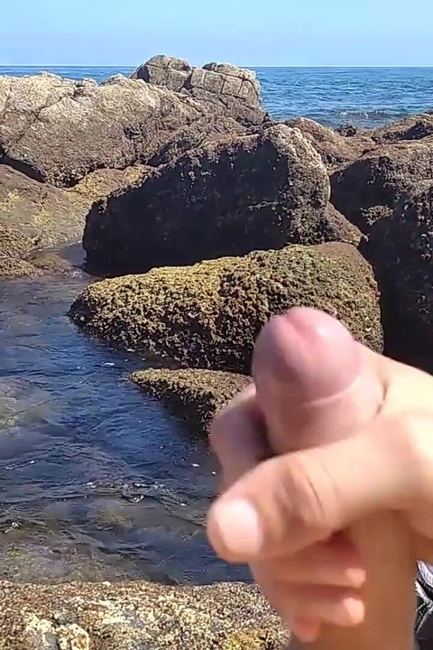 Jerking off a Big Hard Dick Overlooking the Sea in the Beach Cove Until He Cums