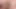 Playing with sex toy while sitting on the edge of my bed