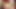 I am naked, lying on the bed with my legs spread and smoking a cigarette