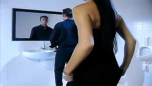 Milf with big tits gets ass fucked in double penetration in men's toilets