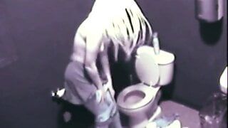 Hot Blonde fingering her pussy public toilet