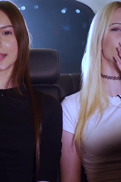 Two Women Smoking and Chatting in a Car at Night
