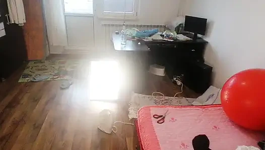 Amateur woman has fun trying on clothes and cutting them.