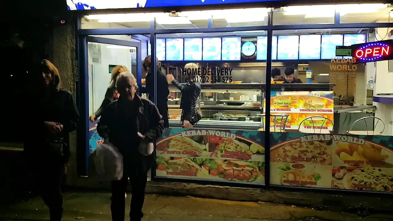 Latex outfit in the kebab shop