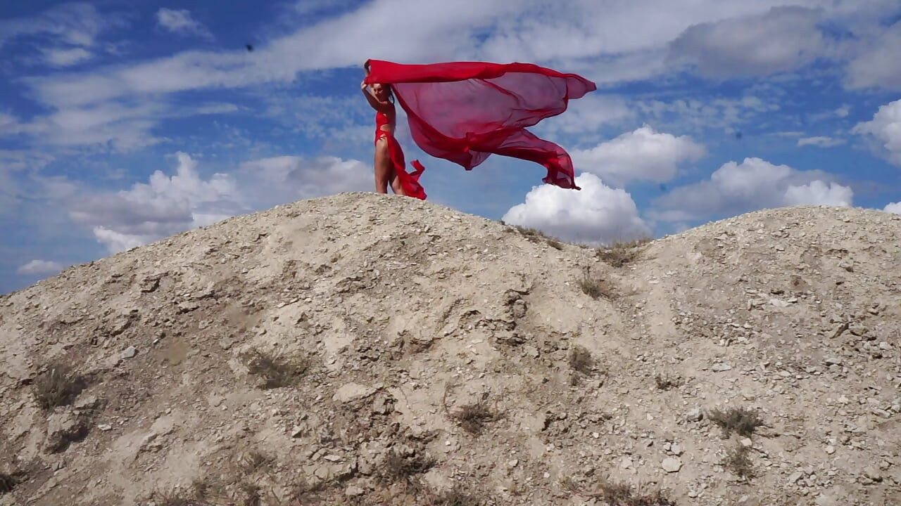 On Top of Hill with Red Flag