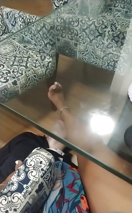 Foot Slave Under Tha Table
