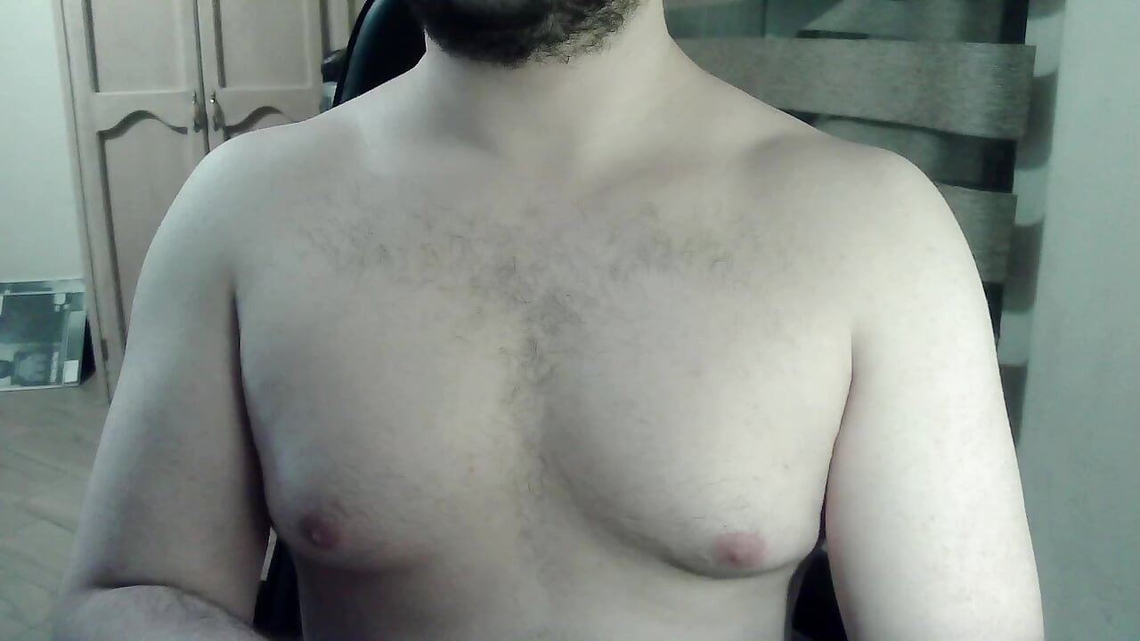 Hot beefy camboy shows off the goods during a show