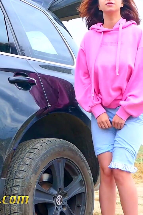 Pee next to the wheel of the car