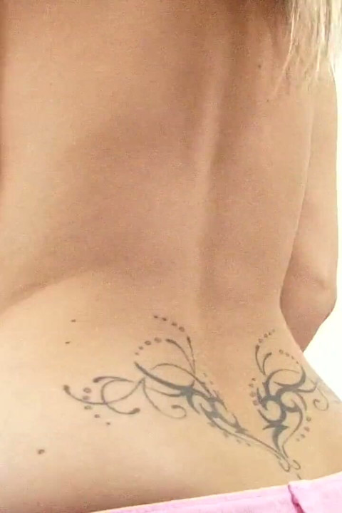 Blonde babe with huge tits gets naked fast in the living room