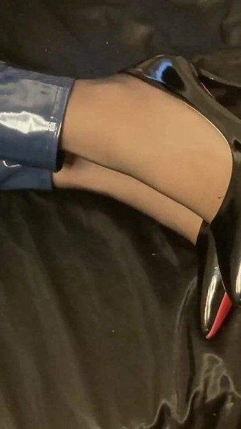 Captivating moment from "Blue Vinyl Leggins, Nylons, High Heel Pumps"
