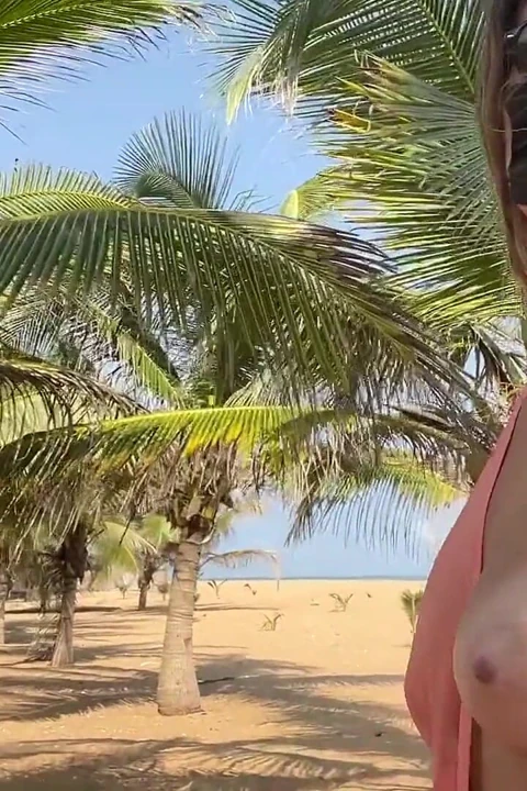 A Busty Blonde Woman Is Walking Around and Showing Her Naked Body on the Beach.