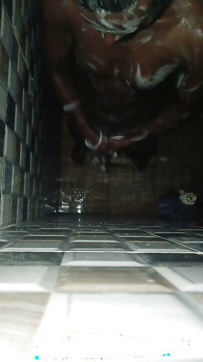 Hot Indian man bathing and playing and cleaning his big cock