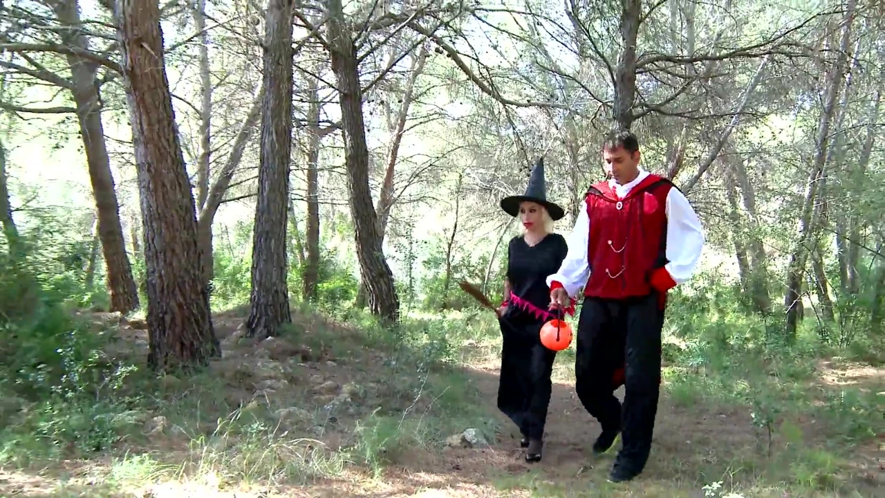 Hot blonde with big tits roughly fucked by two bad guys in the woods dressed up for Halloween