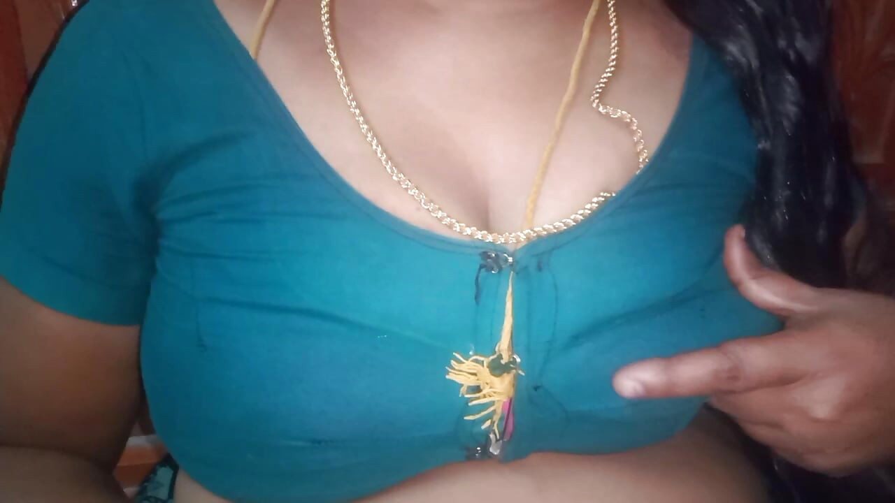 Tamil aunty squeezing her breasts when she is alone and unable to control her emotions.
