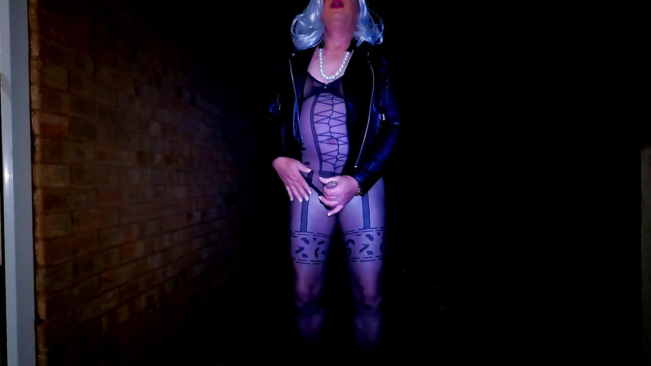 Amateur crossdresser masturbating outdoors in sexy body stocking