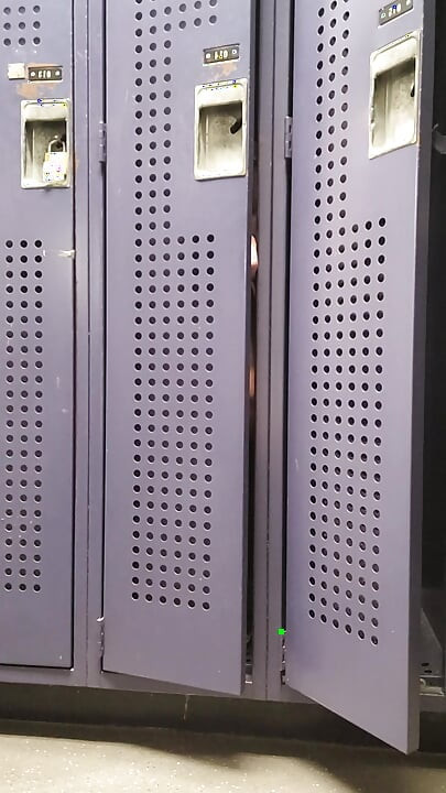 oiled, masturbating in a gym locker room
