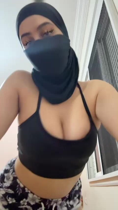 Hijabi Arab solo slut flashes her tits on cam  big Muslim boobs bounce playfully