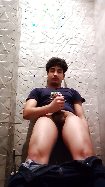 Indian Handsome Boy While His Hard Penis Is Erect and He Strokes His Hand Again in the Toilet Video