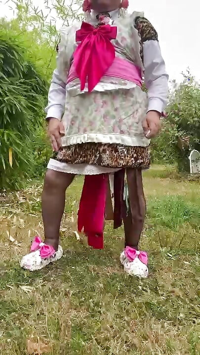 In gardener's outfit with a little leopard dress to pee on all fours