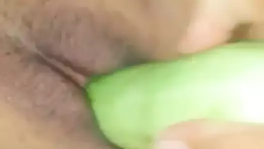 indonesian married couple with cucumber
