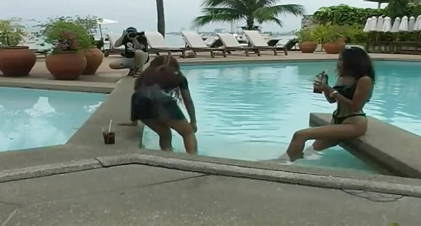2 sexy Latina's presenting latex fetish in the pool and on the beach