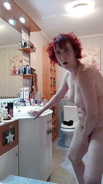 Mature milf masturbating in the bathroom with a carrot