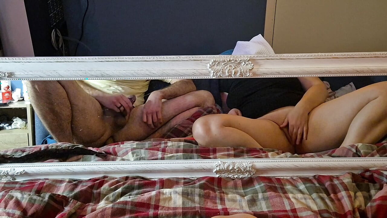 Masturbating together in front of mirror